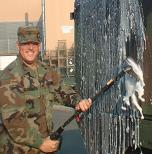 Chris washing the good old Army truck.